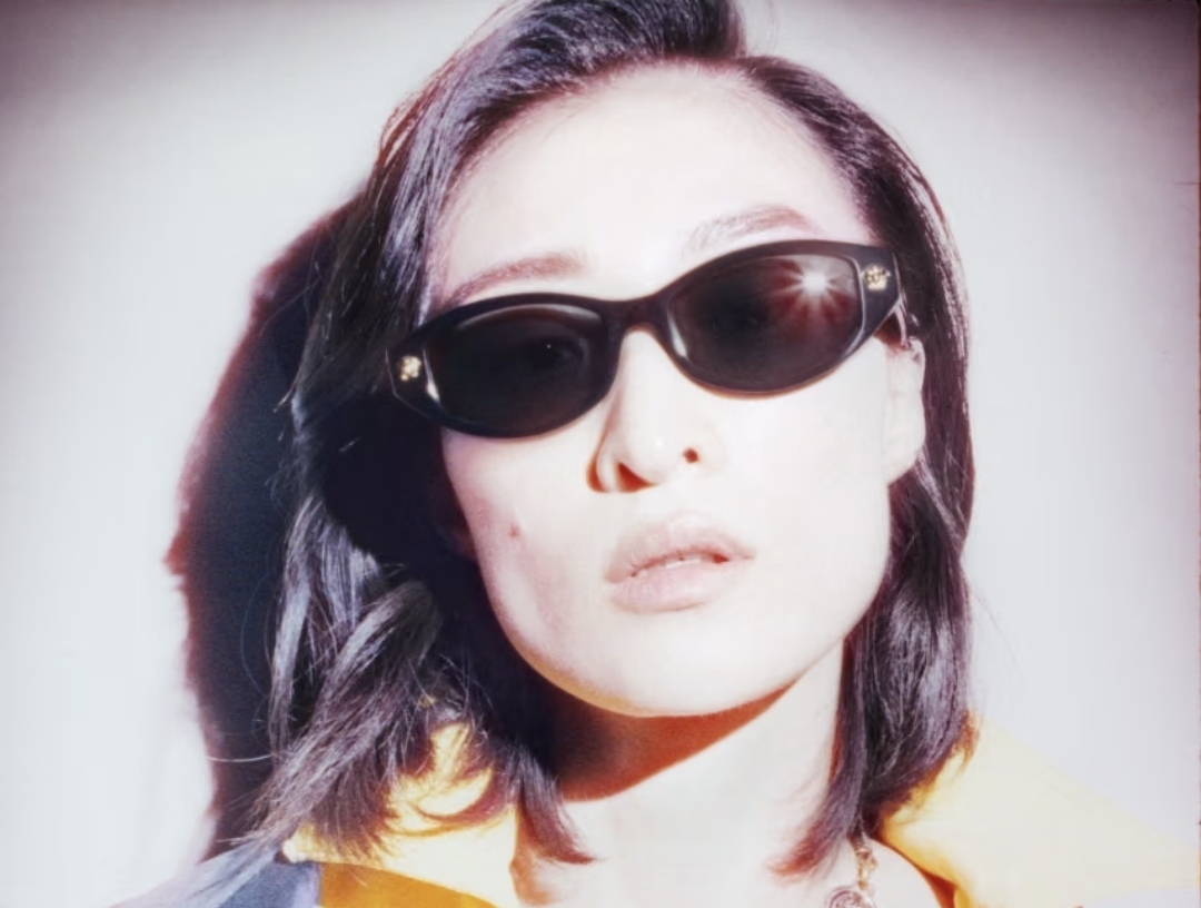 Model wearing black Versace sunglasses