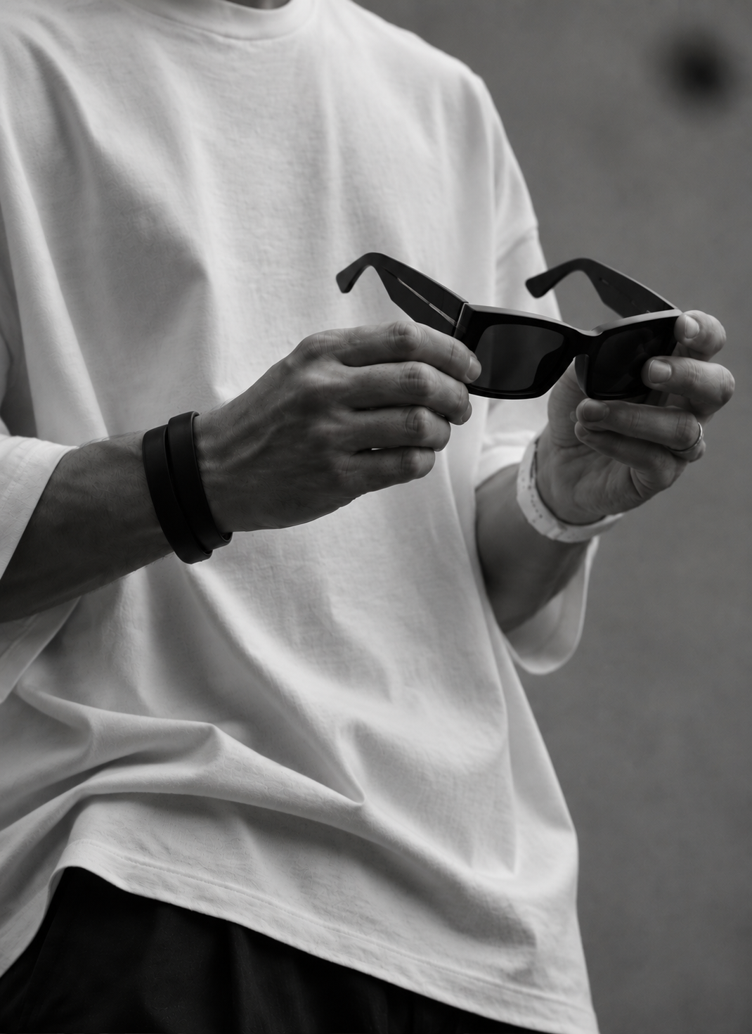 Hand holding a pair of eyewear frames